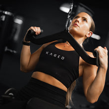 Female Kaged athlete doing a lat pulldown